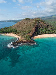 Isolated island with two beach with blue turquoise water with white sand beach. Aerial shot. Hawaii, Maui. Big beach. French Polynesia Tropical paradise