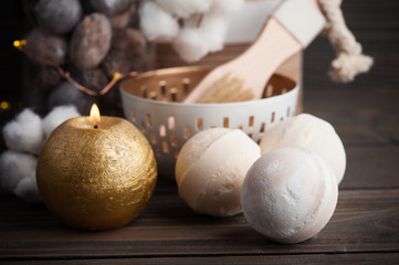 Spa products with golden candle and cotton