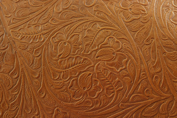 Fototapety  A floral light tan embossed leather background texture.