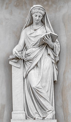 Ancient statue of sensual Italian Renaissance Era woman reading a book, Potsdam, Germany, details,...