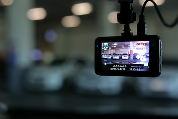 video camera recorder inside vehicle in car park