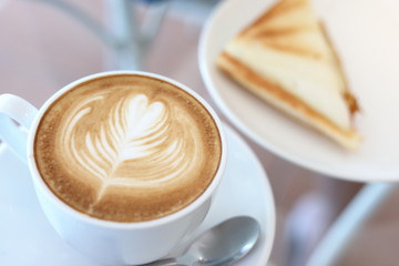 hot latte coffee drink and sandwich put on table breakfast in the morning day