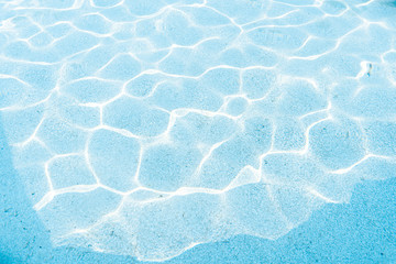 Obraz premium Textured blue water in the pool