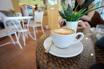 hot latte coffee drink put on table in cafe restaurant