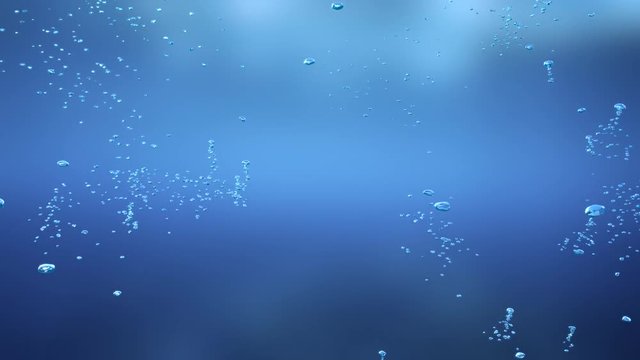 Small air bubbles rise up under water on a blue background. Looped video. Matte included.