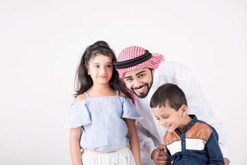 Arab family standing together and smiling