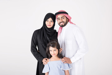 Arab family standing together and smiling