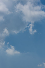 fluffy white cloud above clear blue sky background