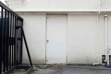 sidewalk by street wall & door