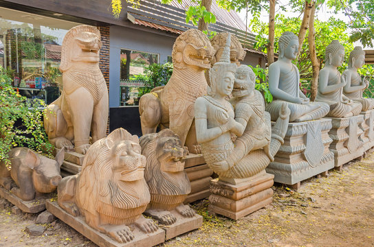 Traditional Buddhist stone figures and statues  for saleon a road in Cambodia