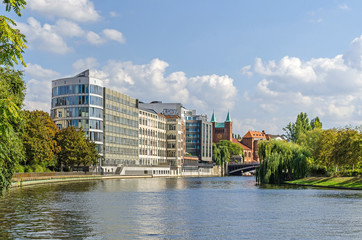 Banks of the River Spree with Adrema hotel and Protestant Parish Church of the Redeemer in Berlin, Germany © laranik