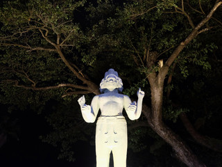 sculpture of a hindu deity with four arms and several faces