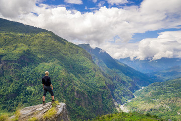Man standing on hill top in Himalayas
