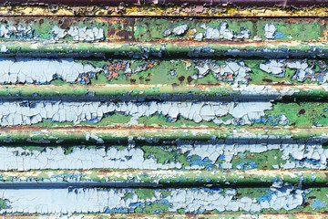 Old cracked rusty peeled colorful paint background texture close-up