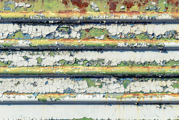 Old cracked rusty peeled colorful paint background texture close-up