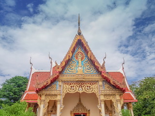 Fototapeta na wymiar Beautiful Gable on top of buddhist temple with cloudy sky background, Wat Pho Banlang, Ban Pong, Ratchaburi, Thailand.