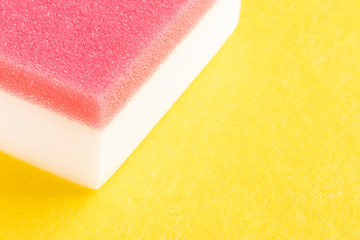 Red-white sponge for washing on yellow matter