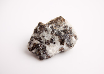 macro photography of natural mineral from geological collection - raw sphalerite rock on white background