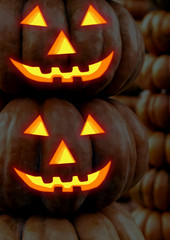 lantern jack pumpkin glowing smile horror decor halloween colorful. vertical set pumpkin one on another lantern jack halloween