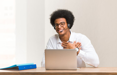 Young telemarketer black man doing a romantic gesture