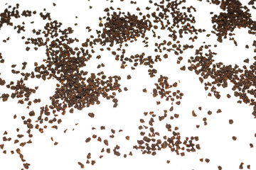 black granulated tea on a white background, isolate