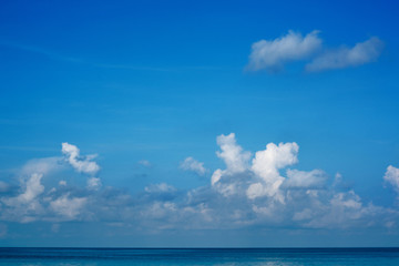 Naklejka na ściany i meble The vast blue sky and clouds sky in summer. The sky is bright with a lot of clouds and it feels good. so beautiful sky image. In the sea