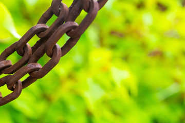border left frame chain hard weathered oval rings copy space on blurred background