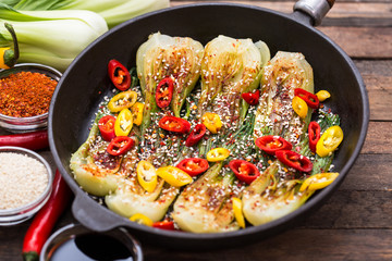 Pak choi stir-fried with sesame and chili pepper