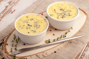 Liver pate with butter in a portion of small dishes. Served individual. Rustic style and natural napkin. Horizontal  view.