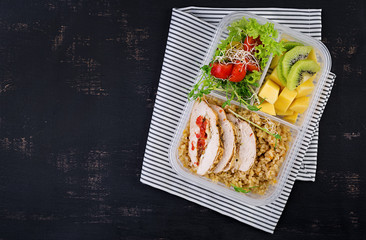 Lunch box  chicken, bulgur, microgreens, tomato  and fruit. Healthy fitness food. Take away. Lunchbox. Top view