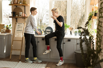 People, homosexuality, same-sex family, gay relationships concept. Male gay internationale couple in the kitchen