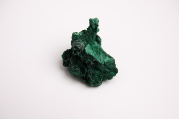 Malachite, green mineral stone isolated on a white background