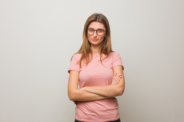 Young russian natural girl crossing arms, smiling and relaxed