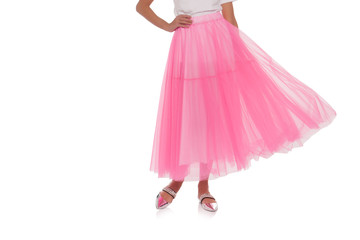 Girl in pink skirt isolated on white