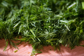 fresh dill on a wooden board