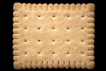 Cracker cookie isolated on black background