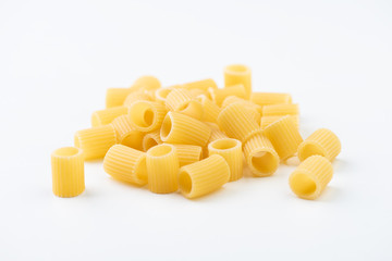 Raw pasta on white surface