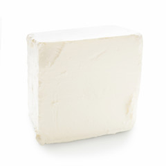 Feta cheese cube on white