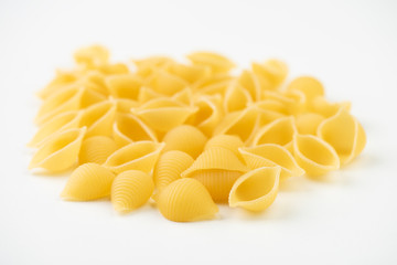 Raw pasta on white surface