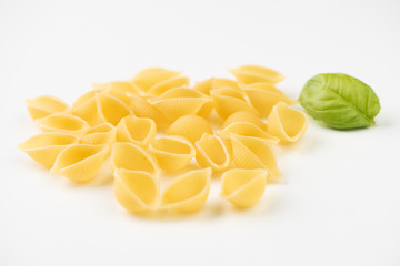 Raw pasta on white surface