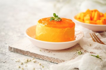 Mango Mousse with sliced ripe mangoes on side, selective focus