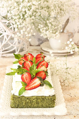 Green spinach cake with strawberry and cream