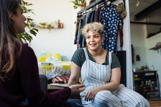 Woman talking with a friend at home