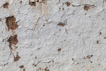 Cracked Texture of Old House of The Mud Wall Painted in White