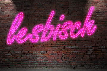Fototapeta na wymiar Neon lettering lesbisch (means lesbian in german) on Brick Wall at night