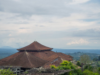 Red roofs of an abandoned hotel in Bali. Beautiful landscape.