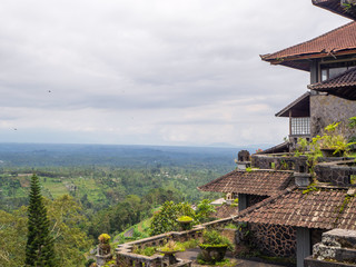 Red roofs of an abandoned hotel in Bali. Beautiful landscape.