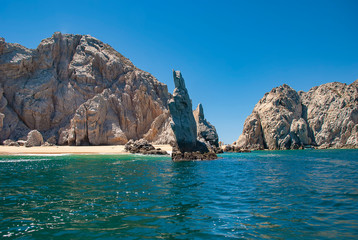 Fototapeta na wymiar Neptunes Finger is rock formation that is easy to spot along the cliffs outside the marina in Cabo San Lucas, Mexico