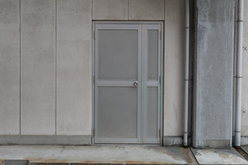 sidewalk by street wall & door