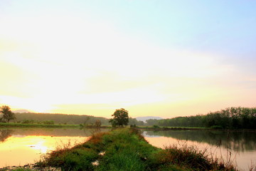 Landscape with river and beautiful sky Twilight on sunrise.Beautiful reflection on the water surface in the morning. 